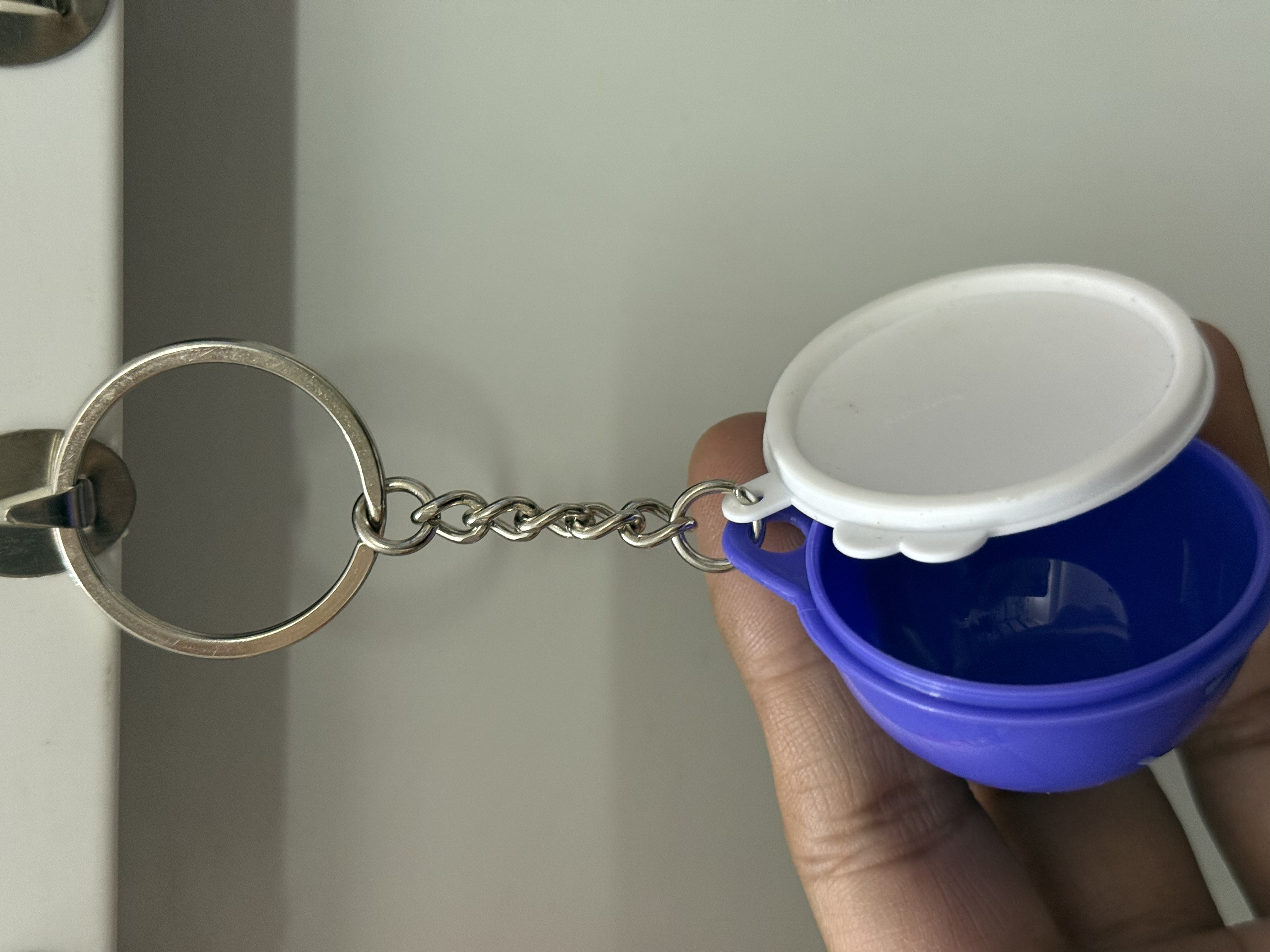 Tupperware keychain openable